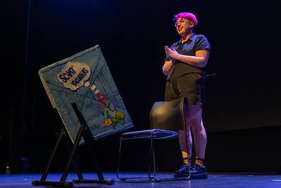 A photo of Brenda, a south asian woman in a lovely green top. Her hair is long and dark with plenty of wave. The photo appears proffesionally done, but we all know she shot it herself, she is that good. 